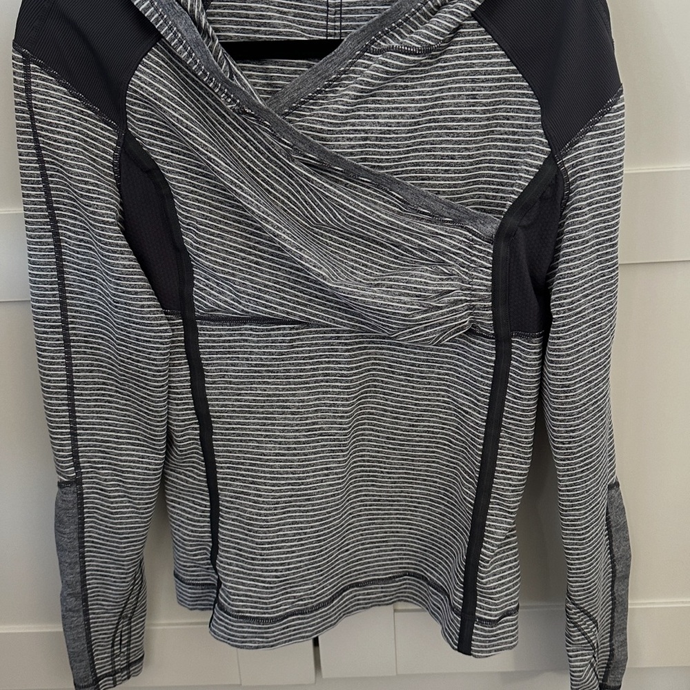 Lululemon striped gray, white and black athletic hoodie. Size 8. Worn twice.